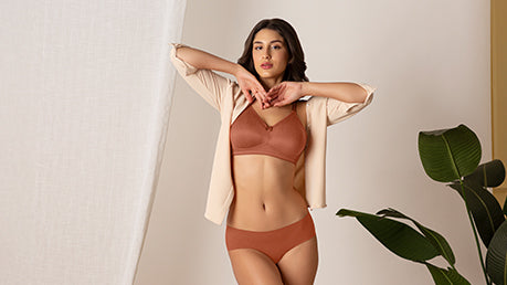 A women wearing Amante's Minimiser Bra and Panty